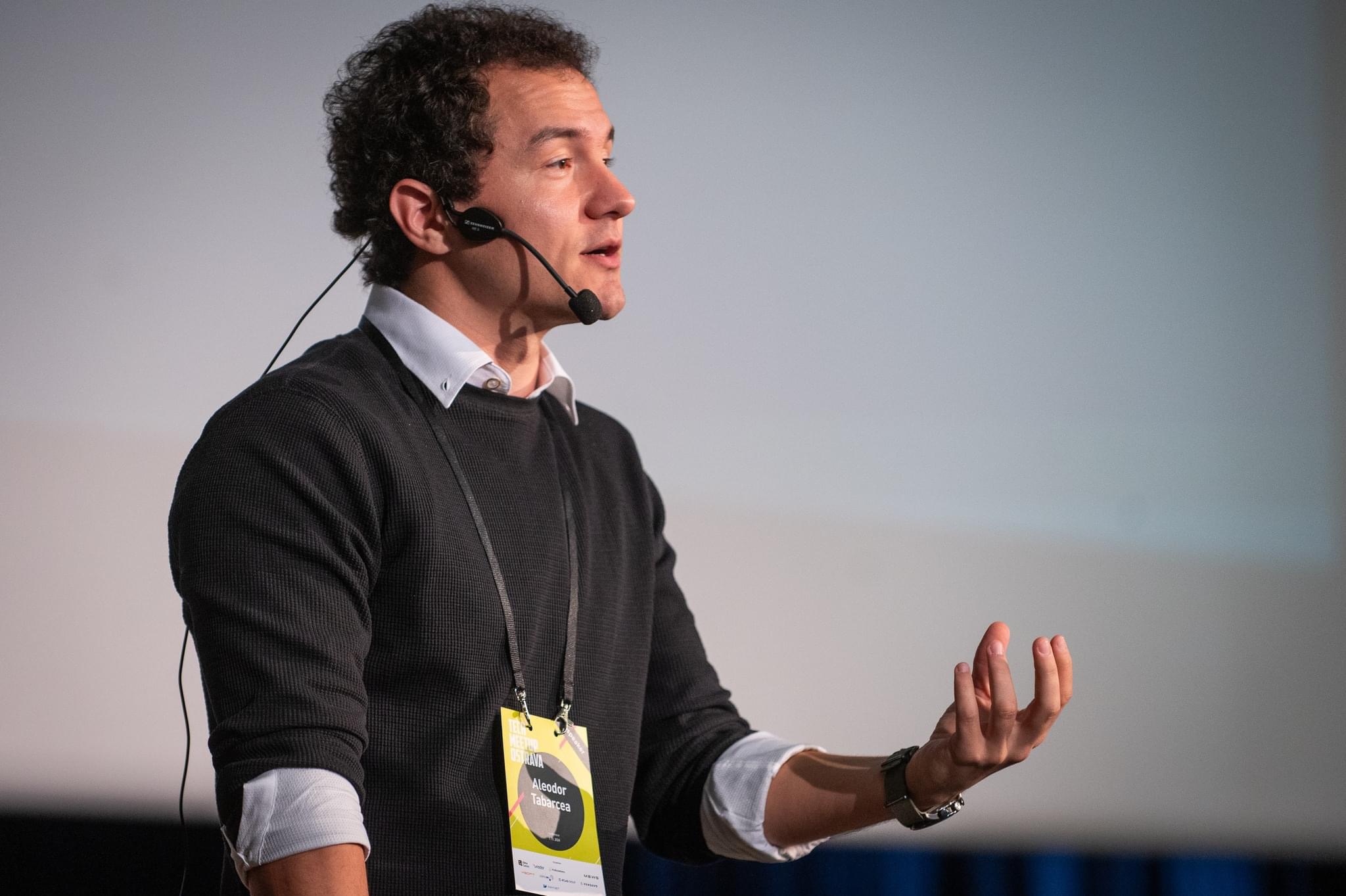 Aleodor speaking at a conference